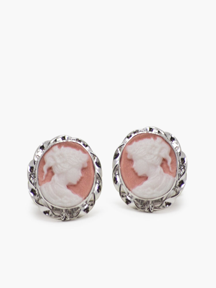 The Pink Mini Cameo Stud Earrings by Vintouch Jewels feature a vintage-style design with silver-tone frames and a white woman’s profile on a pink background.