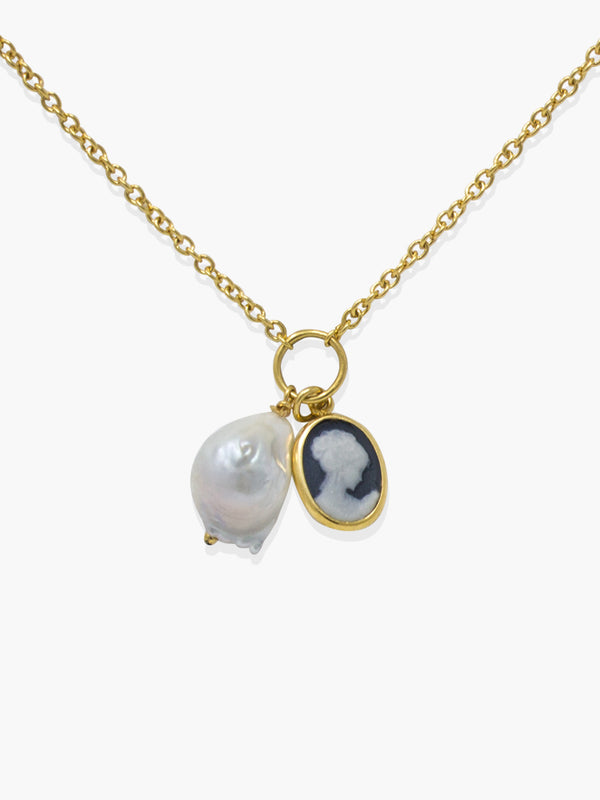 The Black Mini Cameo With A Pearl Necklace by Vintouch Jewels is handmade in Italy, featuring a baroque pearl and a black mini cameo with a white silhouette on a dark background.