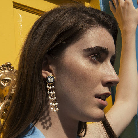 Woman wearing butterfly cameo earrings in gold-plated sterling silver with freshwater pearls, handcrafted in Italy