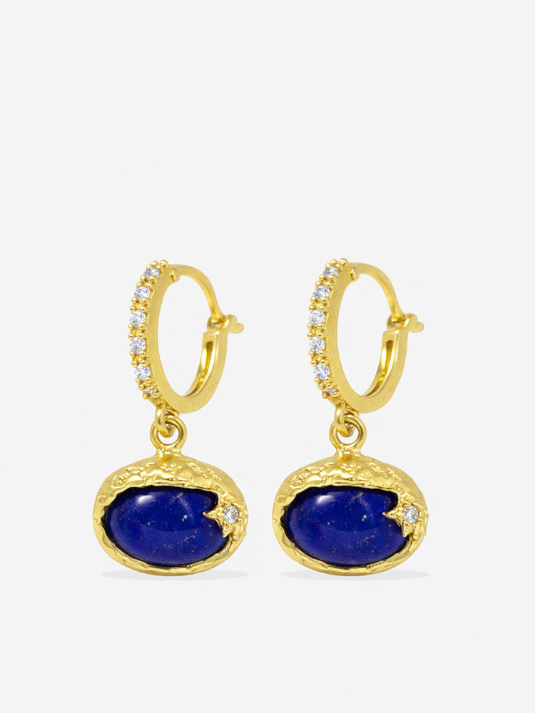 Handcrafted lapis lazuli drop hoop earrings in gold plated sterling silver with horizontal oval cabochon stones and refined diamond accents