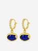 Handcrafted lapis lazuli drop hoop earrings in gold plated sterling silver with horizontal oval cabochon stones and refined diamond accents