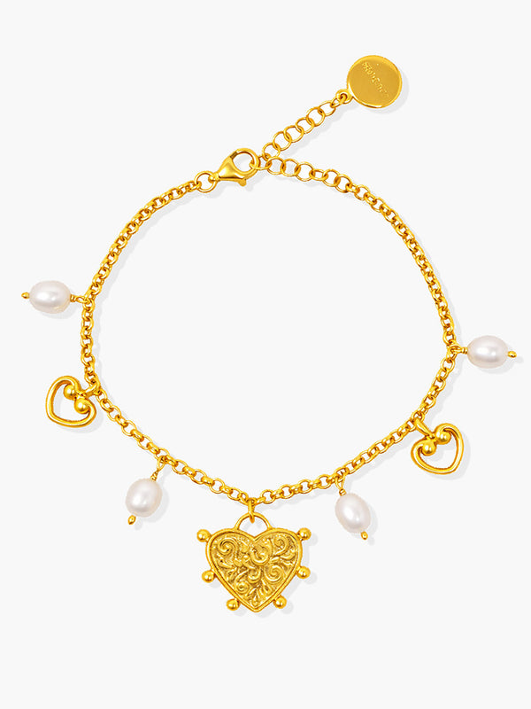 Heartwork gold vermeil bracelet with ornamental heart charm and natural freshwater pearls, handcrafted in Italy