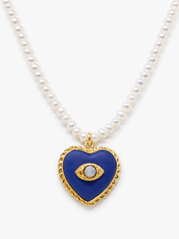 Natural cultured pearl necklace with lapis-blue heart pendant, opal evil eye and 18k gold-plated silver details.
