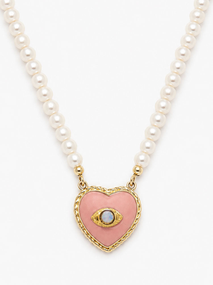 Natural cultured pearl necklace with pink biscuit porcelain heart pendant, opal evil eye and 18k gold-plated silver details.