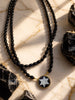 Star Dancer black onyx cameo necklace worn doubled over a white top and black jacket