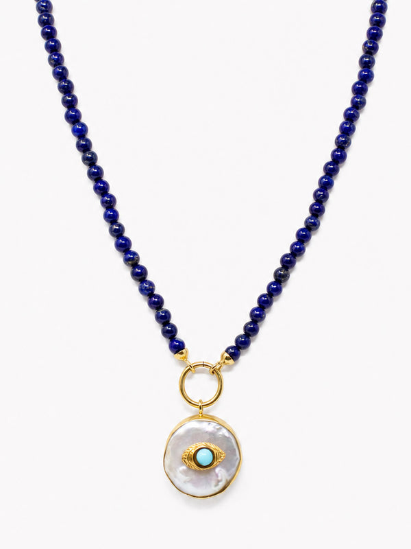 Lapis bead necklace with flat round Akoya pearl pendant, turquoise evil eye charm and golden details.