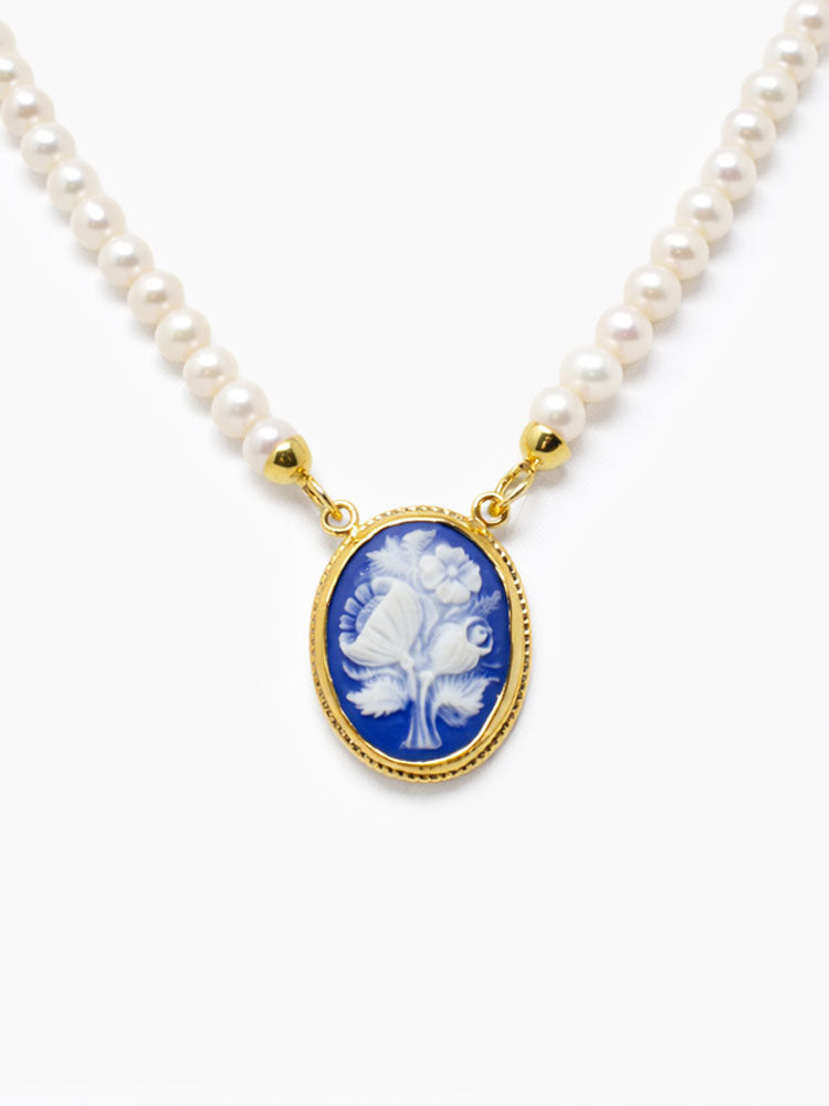 Blue cameo pendant with wildflower design on freshwater pearl necklace in gold-plated silver, handmade Italian jewelry