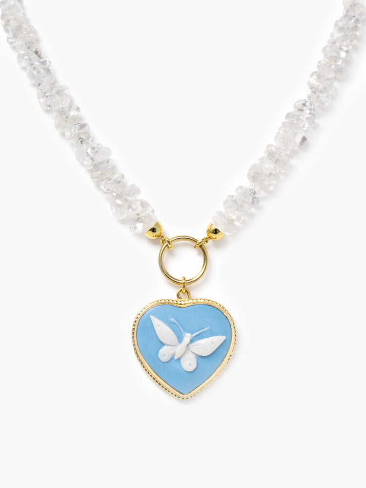 18k gold-plated sterling silver necklace with natural rock crystal chips and sky-blue porcelain heart cameo pendant featuring a hand-carved butterfly.