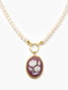 Handcrafted pearl necklace with burgundy porcelain cameo pendant depicting a white pompon flower, mounted in 18k gold-plated sterling silver