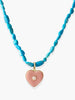 Turquoise necklace with a pink porcelain heart pendant and central opal, handcrafted Vintouch jewelry photographed on a neutral background.