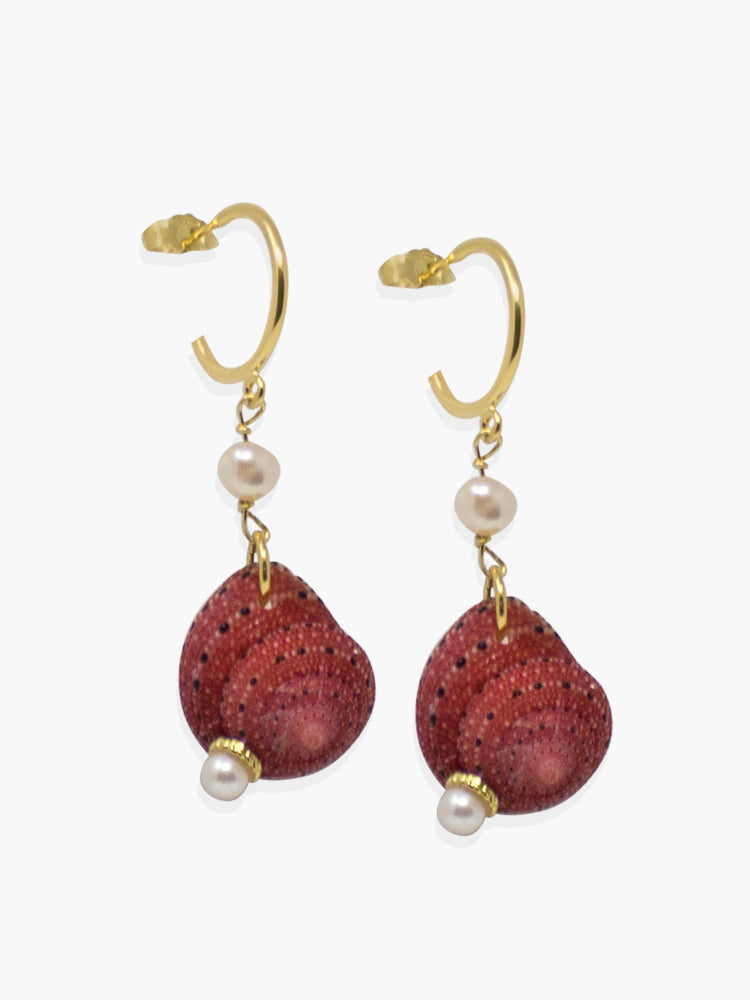 Stand out from the crowd with these elegant though unexpected mini hoop earrings featuring red Zanzibar shells dangling on a 18k gold over silver handmade hoops. 