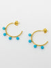 Four Turquoise Beads fixed on 18k gold over silver hoop earrings.